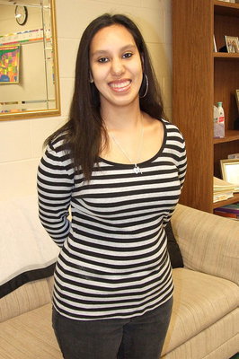 Image: CBI class member Morgan Martinez is professionally dressed for work where she spends half her days at the Happy Heart Day Care facility in Italy.