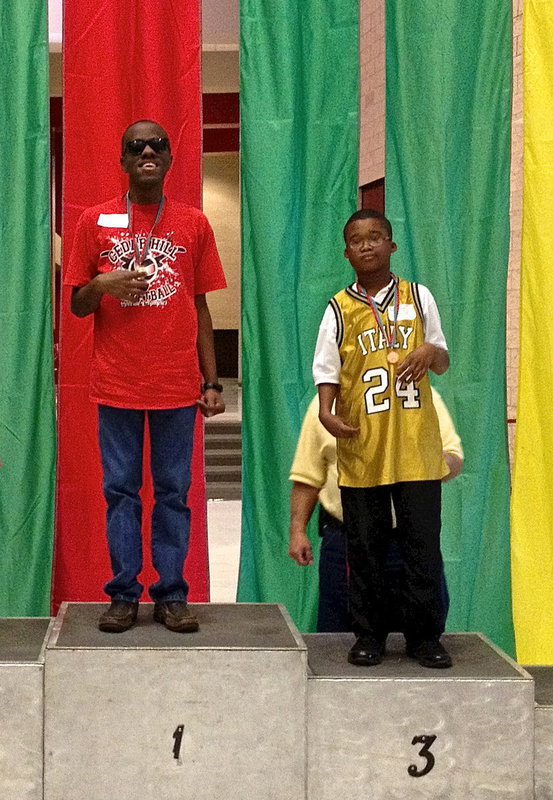 Image: Italy’s #24 David Williams is awarded a 3rd place medal.