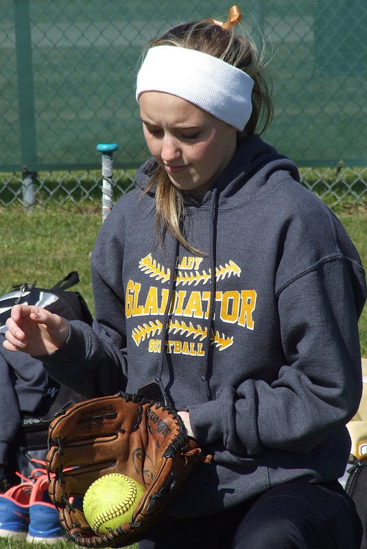 Image: Kelsey Nelson gets in the zone as the Lady Gladiators play pitch-and-catch (sharpening their swords for battle).