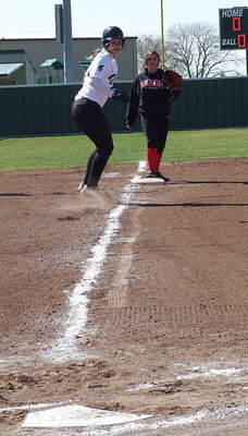 Image: Italy’s Jaclynn Lewis desperately wants to score from third-base but can she reach home plate….?