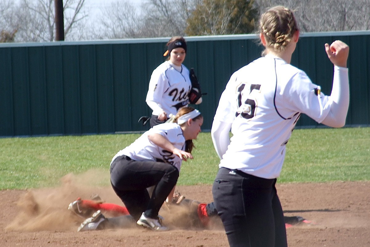 Image: Pitcher Jaclynn Lewis(15) signals out as her catcher, Alyssa Richards, throws out a Terrell base runner at second-base with shortstop Paige Westbrook making the tag and second baseman Morgan Cockerham backing up the play.