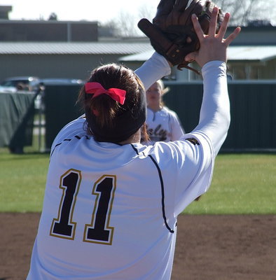Image: Lady Gladiator first baseman Breyanna Beets(11) hauls in a throw from shortstop Paige Westbrook.