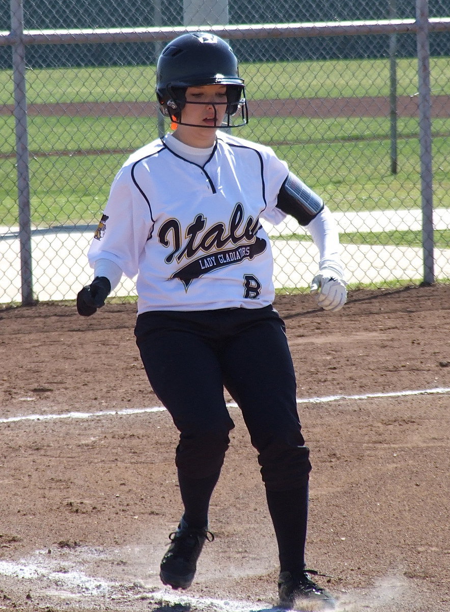 Image: Morgan Cockerham(8) brings everything to a halt after her bunt attempt is ruled foul.