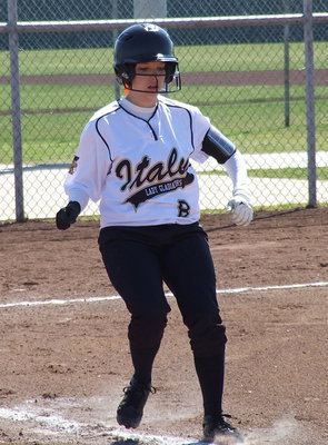 Image: Morgan Cockerham(8) brings everything to a halt after her bunt attempt is ruled foul.