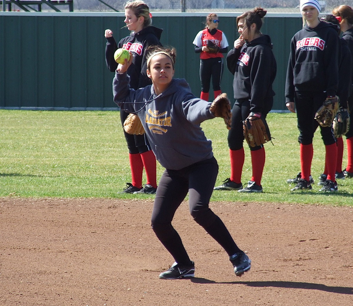 Image: Italy’s Ashlyn Jacinto fields a grounder during pre-game warmups.