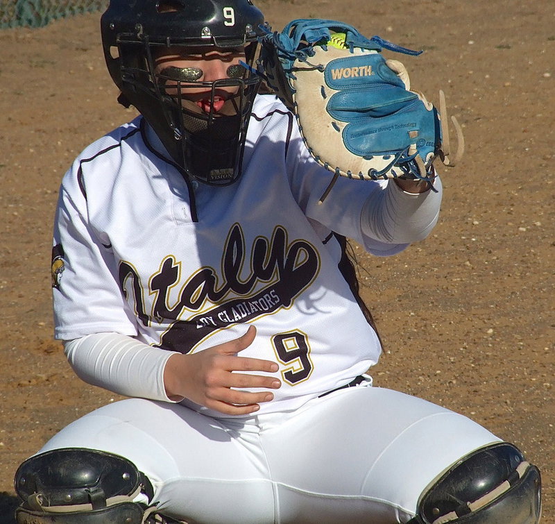 Image: Alysa Richards(9) getting pitcher Jaclynn Lewis ready for Itasca.