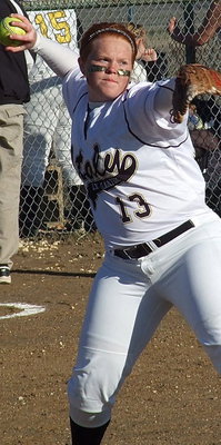 Image: Third-baseman Katie Byers(13) throws to first.