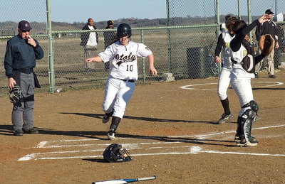Image: Page Westbrook(10) finds home plate and taps it twice for good measure.