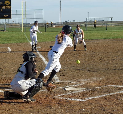 Image: Madison Washington(2) attempts to hit Kelsy Neslon(4) home from third for Italy.