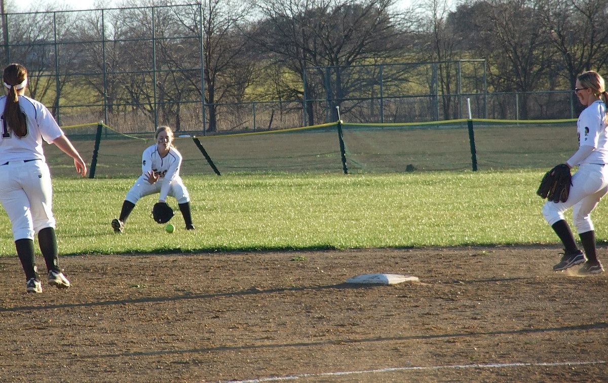 Image: Center fielder Madison Washington(2) collects a liner hit past second-base.