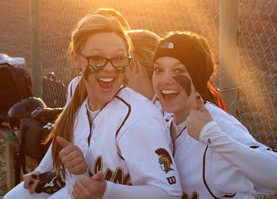 Image: Bailey Eubank(1) and Morgan Cockerham(8) are excited to be 1-0 in district as the sun sets on a late Wampus Cat rally with Itasca’s field having no lights.