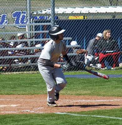 Image: Italy’s Caden Jacinto(2) sends it deep into the outfield.