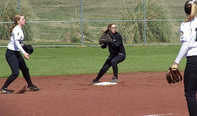 Image: Madison Washington flips the ball to Bailey Eubank for the force out at second against Lorena during tournament play in Corsicana.