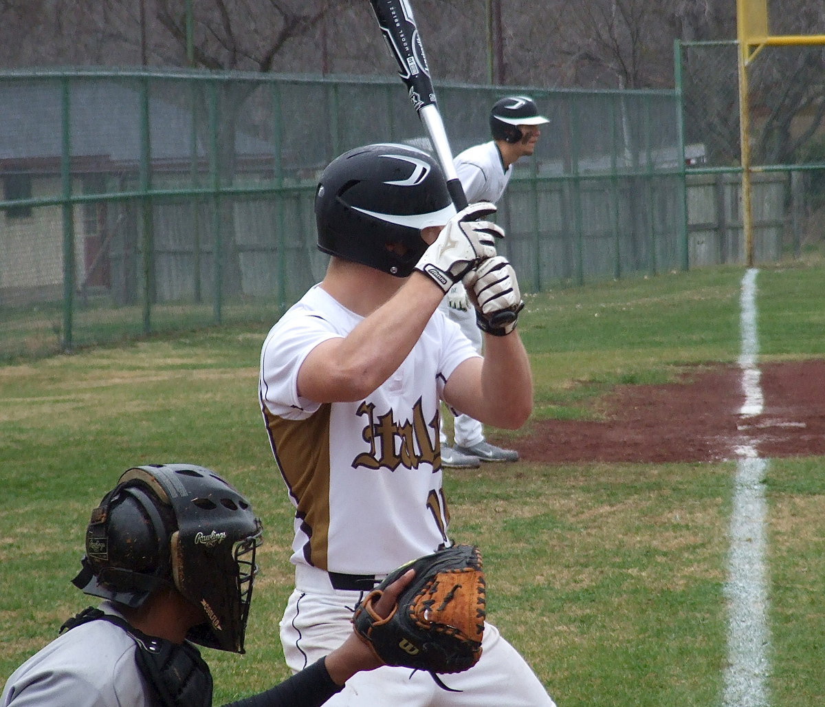 Image: Italy’s Chase Hamilton(10) tries to bring teammate Cole Hopkins(9) home.