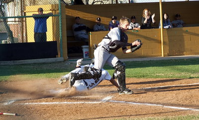 Image: Reid Jacinto(5) slides home but not before Itasca got the force out at the plate. No worries, Italy would ring up 7 straight runs to go up 7-2 before Itasca could collect a third out.