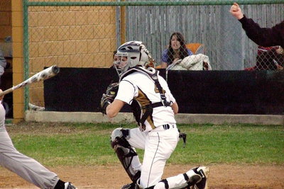 Image: Gladiator catcher Justin Wood(4) hauls in a strike-three pitch to the delight of Jessica Ward who is keeping the game book for Italy.