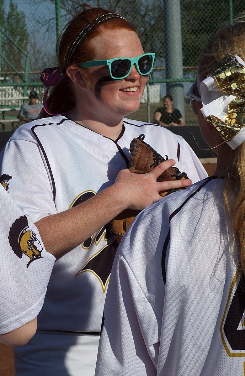 Image: Lady Gladiator Katie Byers(13) enjoys camaraderie with her teammates before Italy’s district matchup against Avalon.