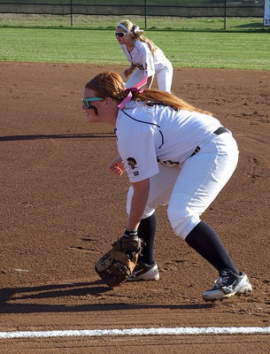 Image: First baseman Katie Byers(13) and second baseman Britney Chambers(4) help keep any Eagles from reaching the first base bag.