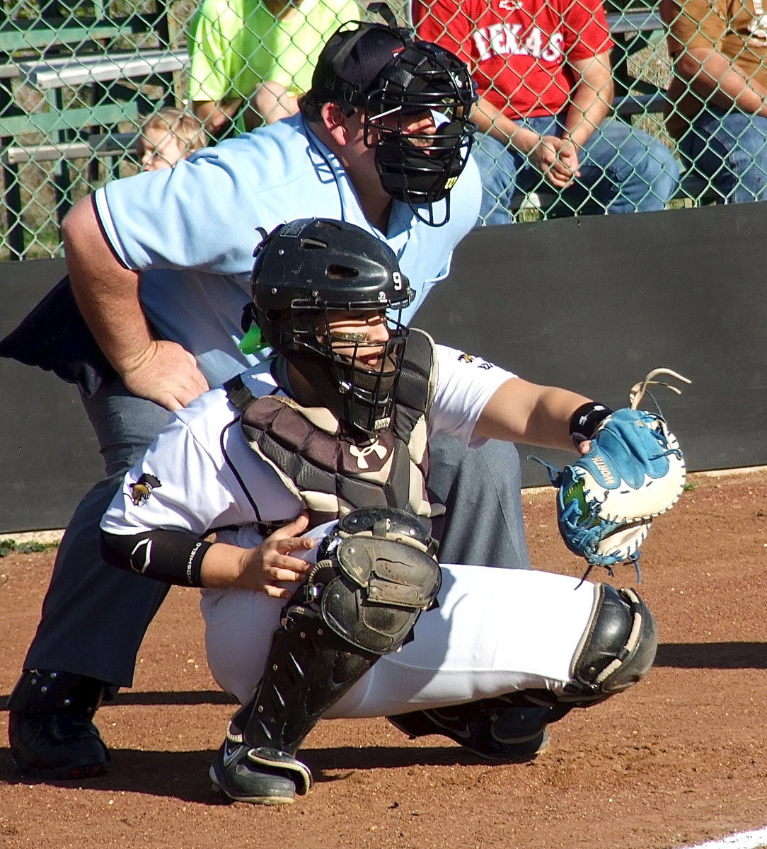 Image: Catcher Alyssa Richards pulls in a strike from pitcher Jaclynn Lewis.