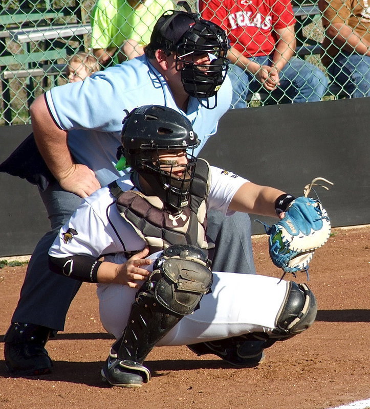 Image: Catcher Alyssa Richards pulls in a strike from pitcher Jaclynn Lewis.