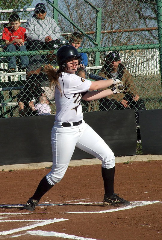 Image: Madison Washington(2) hits one into the outfield.