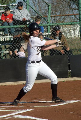 Image: Madison Washington(2) hits one into the outfield.