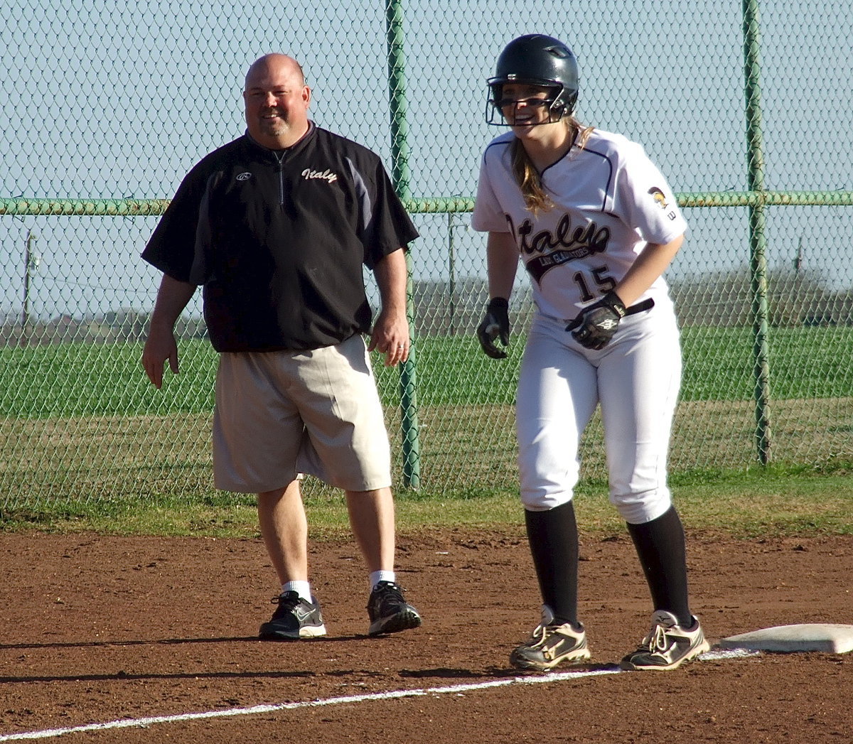 Image: Lady Gladiator head coach Wayne Rowe shares a laugh with Jaclynn Lewis(15).