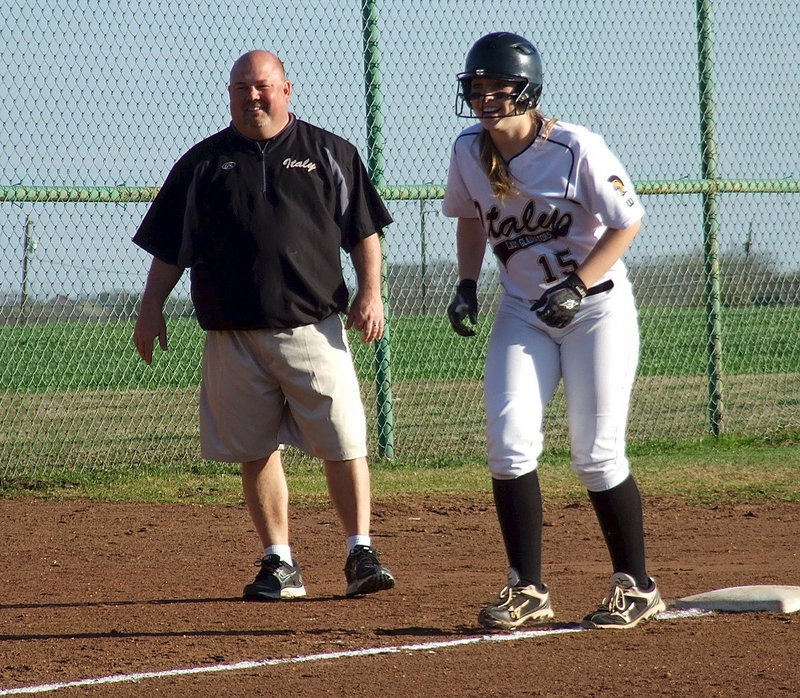 Image: Lady Gladiator head coach Wayne Rowe shares a laugh with Jaclynn Lewis(15).