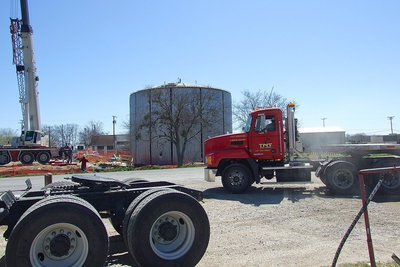 Image: The construction site hustles and bustles with heavy equipment to and from the location site where Highway 34/Main Street crosses Highway 77.