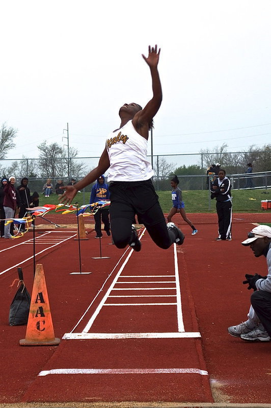 Image: Italy’s Kortnei Johnson reaches for the gold in the long jump.