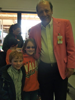 Image: Kaden Houbek (Kindergarten) and  Destini Stroud (2nd grade) stopped to give Dr. DelBosque a hug.