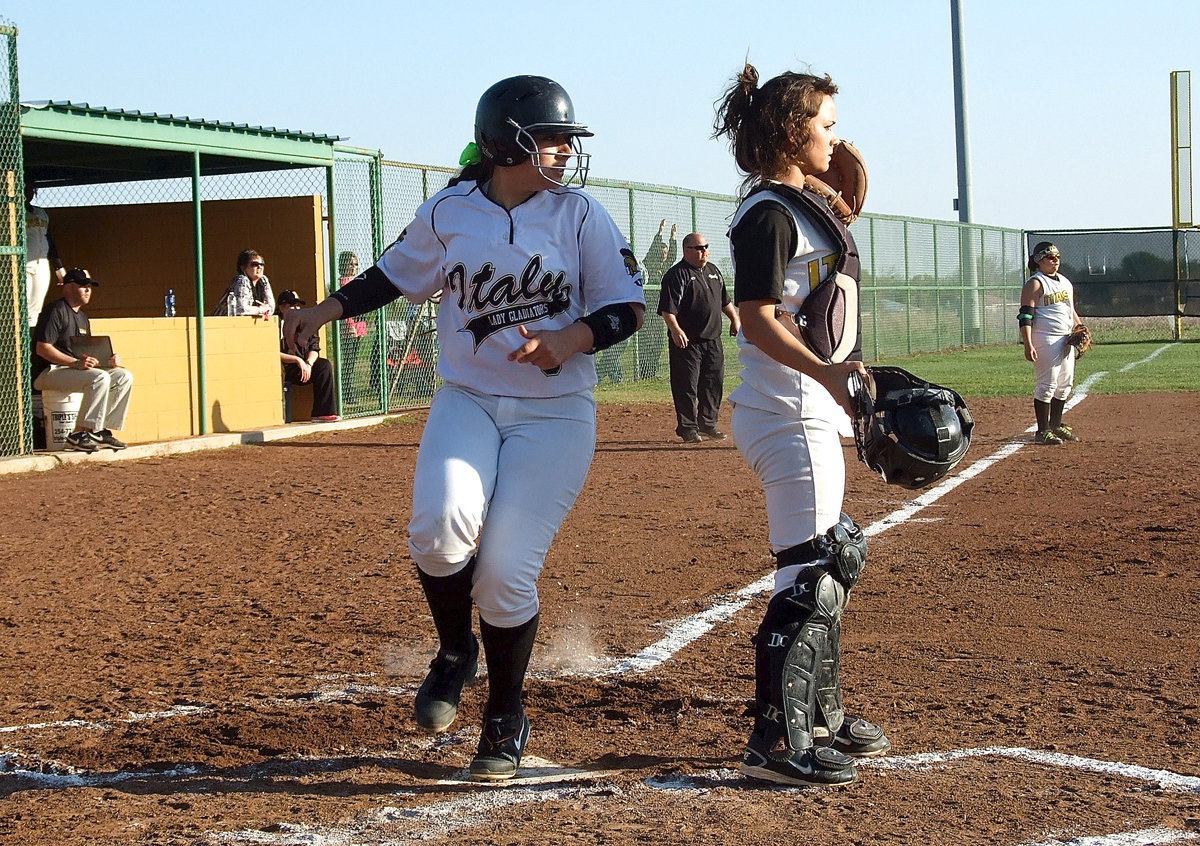 Image: Alyssa Richards(9) reaches home base but not before Itasca gets the third out in what proved to be a hard fought win for Italy with nothing coming easy.