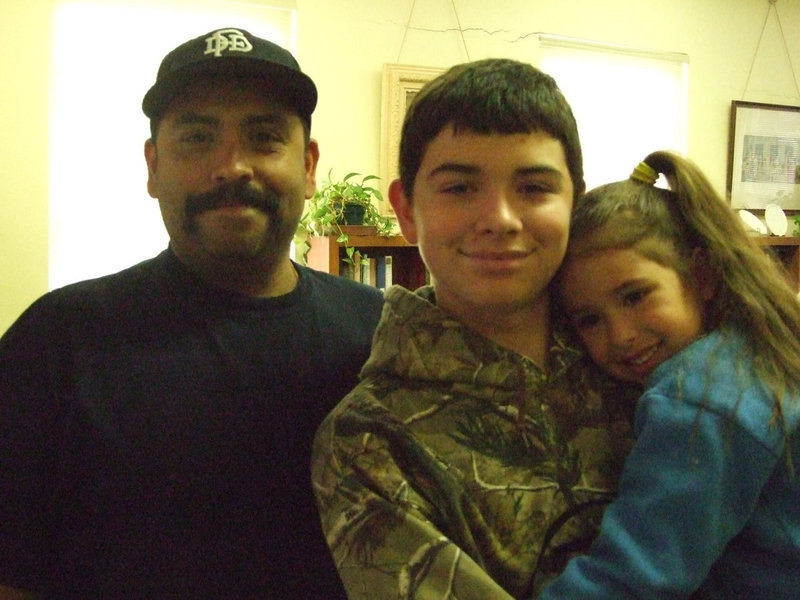 Image: Albert Garcia, Jr and his children, Isaac and Adela, help every year with the Easter Egg hunt.  Even Albert hunted as a child and brought the tradition to his own children.