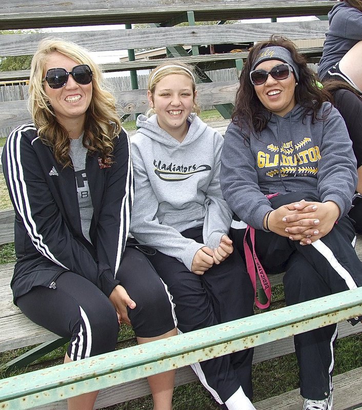Image: 2012 IHS graduate and collegiate softball pitcher Megan Richards, in for a visit from college, enjoys Italy’s win over Frost with sister, “ChaCha” Richards, who is also a pitcher, and mother, Tina Richards who is a Lady Gladiator softball assistant coach.