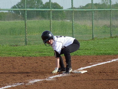Image: Tara Wallis(5) is determined to score a run for Italy.
