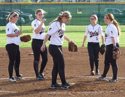 Image: Italy’s infield of Paige Westbrook(10), Madison Washington(2), Bailey Eubank(1) and Katie Byers(13) celebrates another strikeout with pitcher Jaclynn Lewis(15).