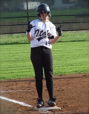 Image: Lady Gladiator Kelsey Nelson(14) is all jazzed after hitting a triple