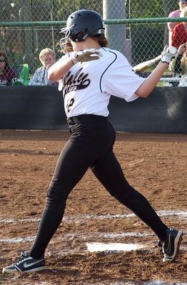 Image: Freshman Lillie Perry(12) battles her way to a walk.