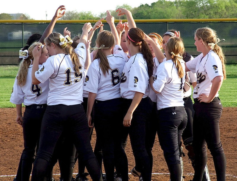 Image: All in! The Lady Gladiators celebrate their 8th straight district win with zero losses.