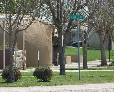 Image: A State Trooper searches dome structures not realizing he is just feet away from the bushes where the suspect would eventually be located and captured.