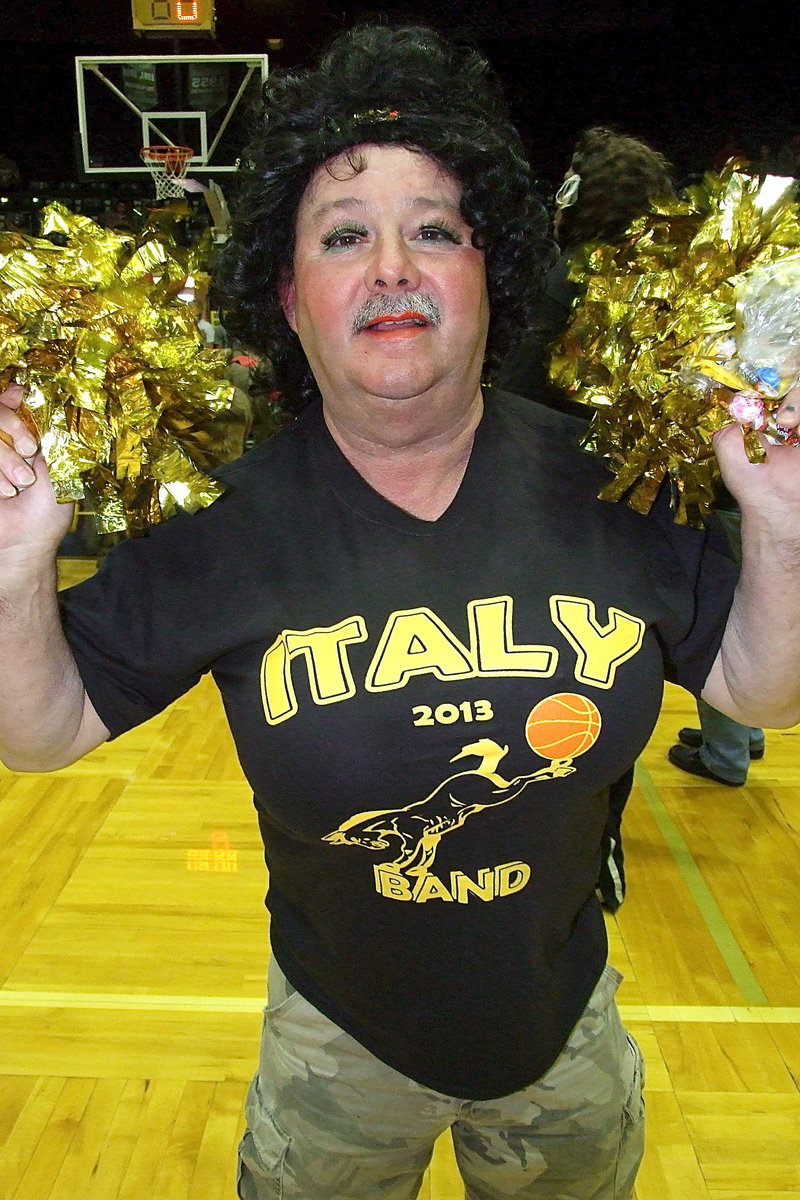 Image: Italy ISD School Board President/Cheerleader Larry “Legs” Eubank kicks up spirit during the donkey basketball games.