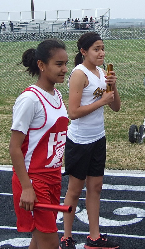 Image: Italy’s Marlen Hernandez, in the gold and white, tries to hold back her nerves before the race.