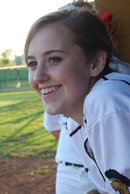 Image: Kelsey Nelson(14) enjoys sharing in her team’s dominating performance against Covington.
