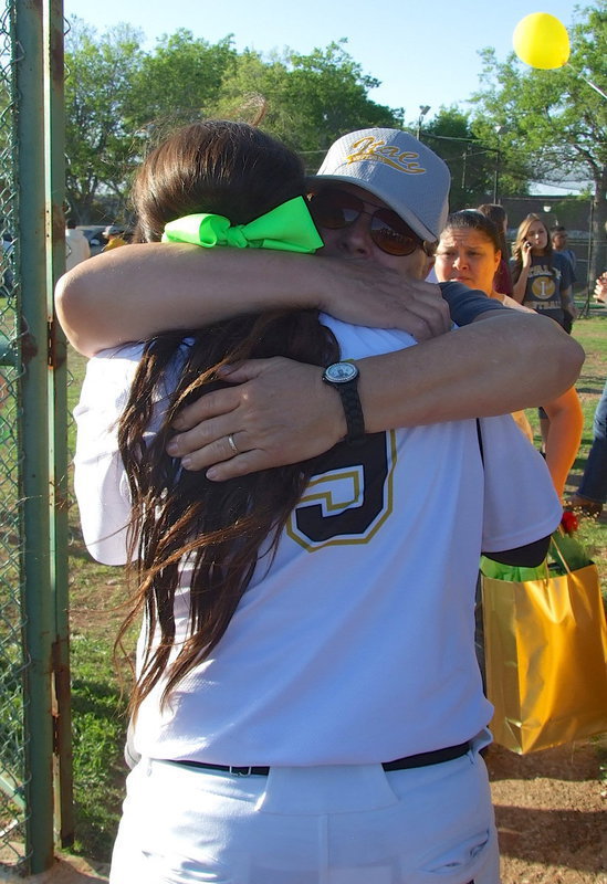 Image: Lady Gladiator senior Alyssa Richards(9) receives a loving hug from loving grandmother Rita Garza on Senior Day.