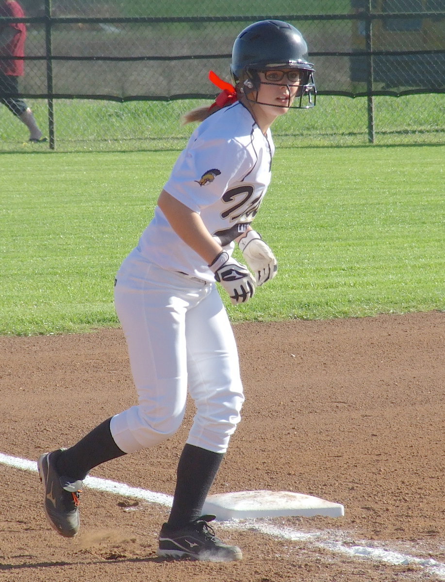 Image: Italy’s Bailey Eubank(1) plots her path to home plate.