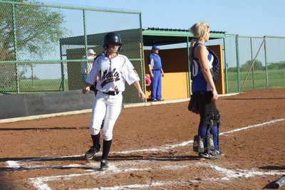 Image: Freshman Lady Gladiator Britney Chambers(4) scores a run.