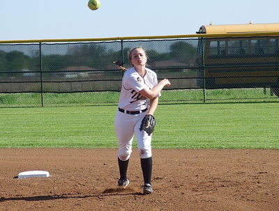 Image: Sophomore shortstop Madison Washington(2) warms up between innings.