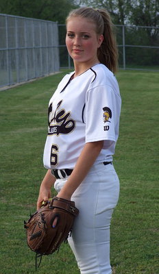 Image: Hannah Washington(6) gets ready to enter the game as the pitcher.