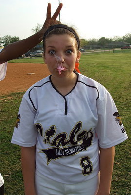 Image: Lady Gladiator senior Morgan Cockerham(8) and her Lady Gladiator teammates burst Faith Family’s bubble to win 24-3 and win the district title undefeated with a 12-0 record.