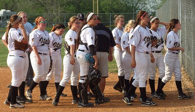 Image: Italy prepares to bat after a meeting with head coach Wayne Rowe.